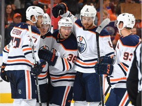 From left, Edmonton Oilers' Oscar Klefbom, Ryan Strome, Jussi Jokinen, Adam Larsson and Ryan Nugent-Hopkins celebrate a goal during NHL pre-season action against the visiting Carolina Hurricanes on Sept. 25, 2017, at Rogers Place.