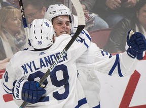 Toronto Maple Leafs' Auston Matthews celebrates with teammate William Nylander after scoring during overtime against the Montreal Canadiens on Saturday, Oct. 14, 2017.