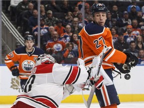 Cam Ward, Milan Lucic

Carolina Hurricanes goalie Cam Ward (30) makes the save as Edmonton Oilers' Milan Lucic (27) screens during second period NHL action in Edmonton, Alta., on Tuesday October 17, 2017. THE CANADIAN PRESS/Jason Franson ORG XMIT: EDM115
JASON FRANSON,