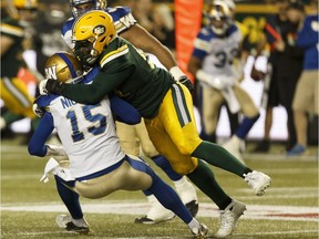 Edmonton's Euclid Cummings (94) sacks Winnipeg's Matt Nichols (15) during the first half of a CFL football game between the Edmonton Eskimos and the Winnipeg Blue Bombers at Commonwealth Stadium in Edmonton, Alberta on Saturday, September 30, 2017.