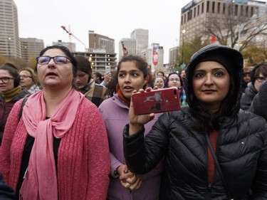 Edmontonians sing Oh Canada during the Stand Together Against Violence in Solidarity with EPS vigil organized by Alberta Muslim Public Affairs Council at Churchill Square in Edmonton, Alberta after a police officer and four bystanders were injured in a terrorist attack on Sunday, October 1, 2017.