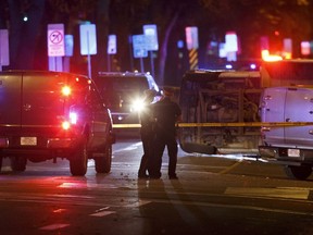 An overturned U-Haul truck is seen on 100 Avenue near 106 Street after Edmonton Police Service officers arrested a man who attacked a police officer outside of an Edmonton Eskimos game at 92 Street and 107A Avenue in Edmonton, Alberta on Sunday, October 1, 2017.