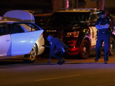 Edmonton police officers investigate after a man attacked a police officer outside of an Edmonton Eskimos game 92 Street and 107A Avenue in Edmonton, on Saturday Sept. 30, 2017.