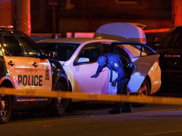 Edmonton police officers investigate after a man attacked a police officer outside of an Edmonton Eskimos game 93 Street and 107A Avenue in Edmonton, on Saturday Sept. 30, 2017.