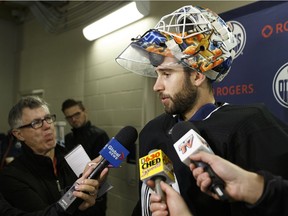 Edmonton Oilers' goaltender Cam Talbot speaks with the media after practice at the Downtown Community Arena at Rogers Place ahead of a Oct. 9 game versus the Winnipeg Jets in Edmonton, Alberta on Sunday, October 8, 2017.