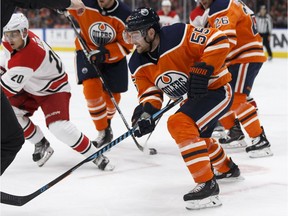 Edmonton's Mark Letestu (55) balltes Carolina's Sebastian Aho (20) during the first period of a NHL game between the Edmonton Oilers and the Carolina Hurricanes at Rogers Place in Edmonton, Alberta on Tuesday, October 17, 2017.