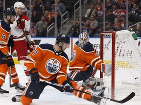 Edmonton's goaltender Laurent Brossoit (1) is scored on by Carolina's Elias Lindholm (28) during the first period of a NHL game between the Edmonton Oilers and the Carolina Hurricanes at Rogers Place in Edmonton on Oct. 17, 2017.