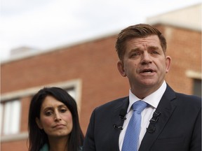 United Conservative Party candidate Brian Jean speaks during a press conference including UCP MLAs Leela Aheer (left), Glenn van Dijken (not shown) and Todd Loewen (not shown), in front of Premier Rachel Notley's constituency office in Edmonton, Alberta on Tuesday, Oct. 24, 2017.