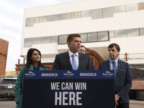 United Conservative Party candidate Brian Jean speaks during a press conference including UCP MLAs Leela Aheer (left), Glenn van Dijken (back) and Todd Loewen (right), in front of Premier Rachel Notley's constituency office in Edmonton on Tuesday, Oct. 24, 2017.