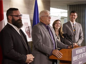 Shaye Anderson, minister of municipal affairs, left, Al Kemmere, president of the Alberta Association of Municipal Districts and Counties, Lisa Holmes, president of the Alberta Urban Municipalities Association, and Don Iveson, mayor of Edmonton, are seen during a news conference about the first comprehensive update to the Municipal Government Act since 1995 at the Federal Building in Edmonton on Thursday, Oct. 26, 2017.
