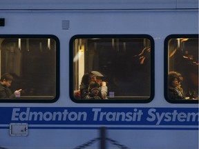 Commuters head home on the LRT as it arrives at South Campus station in Edmonton on Wednesday, Dec. 28, 2016.
