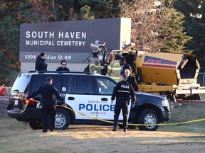 Police and fire crews investigate after a workplace death at South Haven Municipal Cemetery in Edmonton on Oct. 26, 2017.
