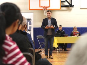 Matt Jeneroux, MP for Edmonton-Riverbend, addresses those gathered at Dr. Margaret-Ann Armour School at 3815 Allan Dr. SW on Saturday, Oct. 28, 2017, during a forum to discuss opposition to supervised injection sites in Edmonton, Alta.