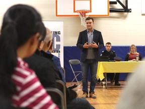 Matt Jeneroux, MP for Edmonton-Riverbend, addresses those gathered at Dr. Margaret-Ann Armour School at 3815 Allan Dr SW on Saturday, Oct. 28, 2017, during a forum to discuss opposition to supervised injection sites in Edmonton.
