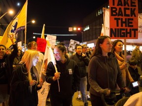 People march in Take Back the Night event on Friday October 27, 2017, in Edmonton. For the second year in a row, it was organized by Women 4 Rights and Empowerment, a grassroots organization.