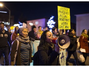 People march in Take Back the Night event on Oct. 27, 2017, in Edmonton. Take Back the Night is a tradition in the women's movement that dates back to 1975 and has become an international movement.