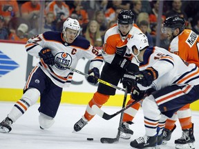 Connor McDavid, Valtteri Filppula, Andrew MacDonald, Patrick Maroon

Edmonton Oilers' Connor McDavid, left, Philadelphia Flyers' Valtteri Filppula, Oilers' Patrick Maroon and Flyers' Andrew MacDonald, battle for control of the puck during the second period of an NHL hockey game, Saturday, Oct. 21, 2017, in Philadelphia. (AP Photo/Tom Mihalek) ORG XMIT: PATM103
Tom Mihalek, AP