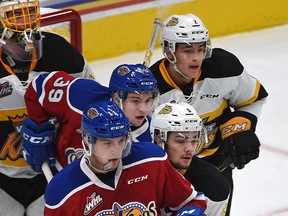 Edmonton Oil Kings Tomas Soustal (11) and Ty Gerla (39) with Brandon Wheat Kings Schael Higson (5) and Braden Schneider (2) all lined up in front of goalie Logan Thompson during WHL action at Rogers Place in Edmonton, October 6, 2017.