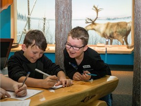 Grade 4 students Ty Radke, left, and Eric Long from St. John Paul II elementary school in Stony Plain, Alta. explore the Royal Alberta Museum in Edmonton as part of their grade 4 social studies curriculum on Dec. 4, 2015. File photo.