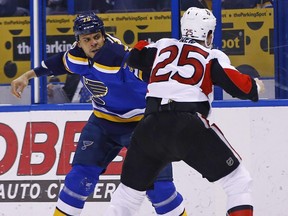 In this Jan. 17 file photo, St. Louis Blues forward Ryan Reaves (left) fights Ottawa Senators forward Chris Neil.