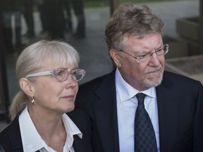 Richard Suter with hIs wife Gayska Suter, left, outside court on June 5, 2013.