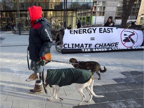 Members of Stop Energy East Halifax protest outside the library in Halifax on Monday, Jan. 26, 2015.