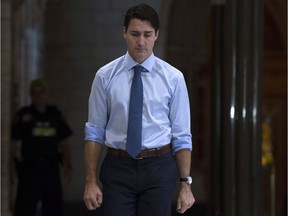 Canadian Prime Minister Justin Trudeau makes his way to caucus on Parliament Hill, in Ottawa on Wednesday, October 18, 2017.