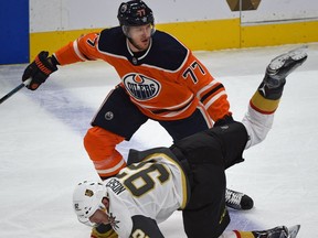 Edmonton Oilers defenceman Oscar Klefbom upends Vegas Golden Knights forward Tomas Nosek during NHL action at Rogers Place on Nov. 14, 2017.
