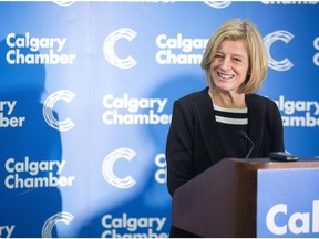 Premier Rachel Notley speaks with reporters following an address to the Calgary Chamber of Commerce at the Telus Convention Centre on Nov. 24, 2017.