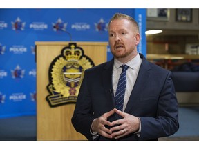Sgt. Kevin Harrison, with the Edmonton Police Service Crisis Negotiators Unit, speaks about a kidnapping scam at the Edmonton Police Headquarters in Edmonton Thursday. Photo by David Bloom