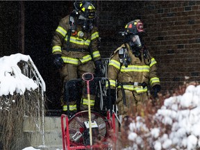 Fire Firefighters work at a house fire near 156 Avenue and 98 Street, Nov. 3, 2017. An elderly man found dead in the blaze had died before the fire broke out, Edmonton fire officials say.