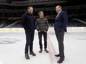 Mark Mattson, president of Swim Drink Fish Canada, left, Hans Asfeldt, a staff member with North Saskatchewan Riverkeeper, and Kevin Lowe, vice-chairman of Oilers Entertainment Group, meet at Rogers Place in Edmonton on Friday, Nov. 3, 2017.