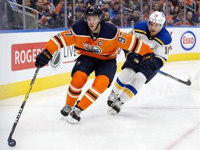 Edmonton Oilers centre Connor McDavid (97) battles the St. Louis Blues' Brayden Schenn (10) during first period NHL action at Rogers Palce in Edmonton Thursday Nov. 16, 2017.