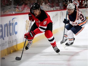 Taylor Hall #9 of the New Jersey Devils takes the puck as Ryan Nugent-Hopkins #93 of the Edmonton Oilers defends in the second period on November 9, 2017 at Prudential Center in Newark, New Jersey.