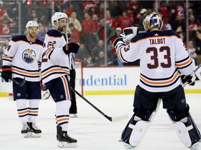 Edmonton Oilers v New Jersey Devils NEWARK, NJ - NOVEMBER 09: Brad Malone #24,Eric Gryba #62 and Cam Talbot #33 of the Edmonton Oilers celebrate the 3-2 overtime win over the New Jersey Devils on November 9, 2017 at Prudential Center in Newark, New Jersey. (Photo by Elsa/Getty Images) Elsa, Getty Images