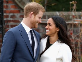 Prince Harry and Meghan Markle during an official photocall to announce the engagement of Prince Harry and actress Meghan Markle at The Sunken Gardens at Kensington Palace on Nov. 27, 2017 in London, England.