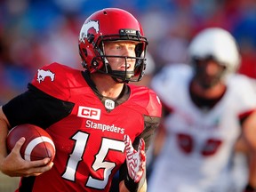 Calgary Stampeders quarterback Andrew Buckley runs for a touchdown against the Ottawa Redblacks during CFL football in Calgary. AL CHAREST/POSTMEDIA