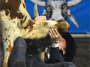 Tanner Milan from Cochrane, Alberta competes in the steer wrestling during the 44th Canadian Finals Rodeo at Northlands Coliseum in Edmonton, November 10, 2017.