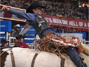 Layton Green from Meeting Creek, Alberta, scores 86 in the Saddle Bronc riding during the 44th Canadian Finals Rodeo at Northlands Coliseum in Edmonton, Nov. 10, 2017.