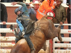 Ponoka, Alberta bullrider Zane Lambert was Day 9 winner in bulls at the Calgary Stampede rodeo on Saturday, July 16, 2016.