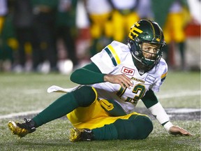 Edmonton Eskimos QB quarterback Mike Reilly looks on after being knocked to the ground during the CFL Western Final in Calgary between the Calgary Stampeders and the Edmonton Eskimos on Sunday, Nov. 19, 2017.