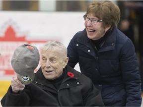 Clare Drake tips his hat to the crowd with his wife Dolly as the University of Alberta Athletics department held a special ceremony to honour former Golden Bears hockey coach Clare Drake's upcoming induction into the Hockey Hall of Fame. The ceremony took place before the Golden Bears game vs Lethbridge in Edmonton on Saturday Nov. 11, 2017.