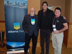 Three former Progressive Conservative MLAs pose beside Alberta Party banner. Left to right: Ron Casey, Stephen Khan, Dave Quest. Graham Thompson/Postmedia