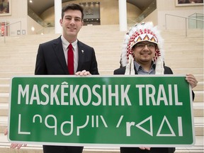 Edmonton Mayor Don Iveson and Enoch Cree Nation Chief Billy Morin pose for a photo following the official announcement of the renaming of 23 Avenue between 215 Street and Anthony Henday to Maskekosihk Trail, during a press conference at City Hall, in Edmonton Alta. on Friday Feb. 12, 2016.