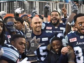 Toronto Argonauts quarterback Ricky Ray (15) and teammates celebrate their win over the Saskatchewan Roughriders in the CFL East Division final on Nov. 19.