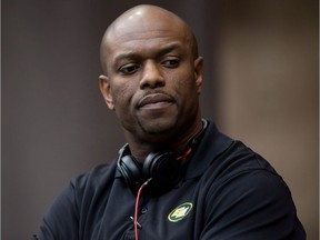 Edmonton Eskimos' general manager Ed Hervey stands on the sidelines before a CFL football game against the B.C. Lions in Vancouver on June 28, 2014. The Lions hired Hervey as general manager on Thursday.