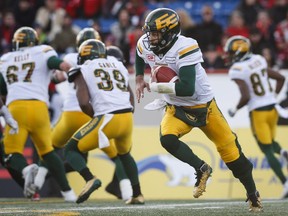 Edmonton Eskimos' quarterback Mike Reilly runs the ball during first quarter CFL West Final football action against the Calgary Stampeders in Calgary on Nov. 19, 2017.