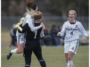 Kristen Skrundz and keeper Emily Burns of the MacEwan University Griffins celebrate the win over the University of Alberta Pandas 2-1, on October 29, 2017 at Foote Field in Edmonton.
