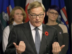 David Eggen (middle, Alberta Minister of Education), Ace Peace (left, transgender student) and Lindsay Peace (right, mother of Ace Peace) at the Alberta Legislature on Thursday Nov. 2, 2017 where Eggen introduced Bill 24 to strengthen Gay Straight Alliance (GSA) legislation in Alberta.