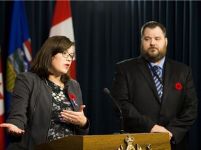 Justice Minister Kathleen Ganley provides details about the proposed changes to the Alberta Human Rights Amendment Act, 2017, with Hugh Willis, spokesman for Canadian Condominium Institute, on Wednesday, Nov. 1, 2017.